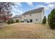 Beige two-story house with sliding glass doors at 4836 Pepper Dr, Harrisburg, NC 28075