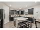 Modern kitchen with dark cabinets and granite countertops at 4836 Pepper Dr, Harrisburg, NC 28075