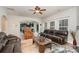 Living room with view into kitchen and access to backyard at 4836 Pepper Dr, Harrisburg, NC 28075