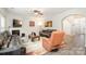 Living room with hardwood floors and an archway leading to other areas at 4836 Pepper Dr, Harrisburg, NC 28075