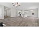 Open living room and kitchen with vinyl plank flooring at 6707 W Sugar Creek Rd, Charlotte, NC 28269