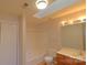 Clean bathroom featuring a bathtub, toilet and vanity with mirror at 8121 #E Tremaine Ct, Charlotte, NC 28227