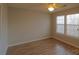 Bedroom with hardwood floors, ceiling fan, and neutral walls at 8121 #E Tremaine Ct, Charlotte, NC 28227