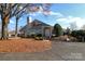Exterior view of community building with landscaping at 8121 #E Tremaine Ct, Charlotte, NC 28227