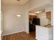 Dining area with hardwood floors and view of kitchen at 8121 #E Tremaine Ct, Charlotte, NC 28227