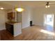 Open kitchen with hardwood floors and breakfast bar at 8121 #E Tremaine Ct, Charlotte, NC 28227