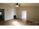 Living room with hardwood floors, fireplace, and vaulted ceiling at 8121 #E Tremaine Ct, Charlotte, NC 28227