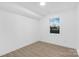 Bright bedroom with wood-look floors and a window offering natural light at 904 Harbor Islands Ct, Gastonia, NC 28056