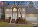 Two-story home with lighted exterior at dusk at 9530 Harris Glen Dr, Charlotte, NC 28269