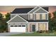 Two-story house with gray siding, white garage door, and landscaping at 1009 Kinship Dr # 71, Lancaster, SC 29720
