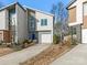 Modern two-story home with attached garage and landscaped front yard at 104 Mattoon St, Charlotte, NC 28216