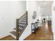 Modern staircase with wood and metal accents at 104 Mattoon St, Charlotte, NC 28216