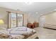 Comfortable bedroom with queen bed, dresser, and additional sleeping area at 105 Whimbrel Ln, Mooresville, NC 28117