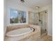 Bathroom with soaking tub and walk-in shower at 11613 Old Surry Ln, Charlotte, NC 28277