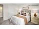 Well-lit bedroom with a full-size bed and neutral decor at 130 Meadow View Dr, Statesville, NC 28677