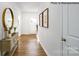 Light and airy entryway with hardwood floors and a decorative console table at 130 Meadow View Dr, Statesville, NC 28677