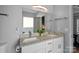 Double vanity bathroom with granite countertops and a bathtub at 13917 Sugar Oats Ln, Charlotte, NC 28213