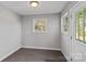 Clean and spacious laundry room with tile flooring and exterior access at 13917 Sugar Oats Ln, Charlotte, NC 28213