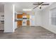 Kitchen with wood cabinets, white appliances, and laminate flooring at 1731 Long Paw Ln, Charlotte, NC 28214