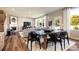 Modern dining room with black chairs, dark wood table and hardwood floors at 2208 Millennium Dr # 88, Lancaster, SC 29720