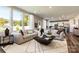 Open concept living room and kitchen with hardwood floors and stylish furniture at 2208 Millennium Dr # 88, Lancaster, SC 29720