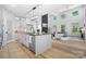 Modern kitchen island with a breakfast bar and open view to living room at 2943 Sparrow Springs Rd, Gastonia, NC 28052