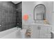 Modern bathroom with dark tile, white vanity, and bathtub at 336 Anthony Cir, Charlotte, NC 28211