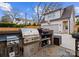 Luxury outdoor kitchen with grill and prep area at 336 Anthony Cir, Charlotte, NC 28211