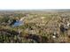 Aerial view of house, pond and surrounding wooded area at 532 Rutledge Dr, Catawba, SC 29704