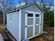 Gray shed with white trim and double doors at 532 Rutledge Dr, Catawba, SC 29704