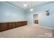 Basement recreation room with built-in cabinets and additional storage space at 6156 Falls Ridge Trl, Sherrills Ford, NC 28673