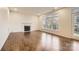 Spacious living room with hardwood floors, fireplace, and access to backyard at 118 Shorecrest Dr, Davidson, NC 28036