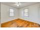 Well-lit bedroom with hardwood floors and two windows at 1337 Eisenhower Rd, Rock Hill, SC 29730