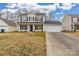 Two-story house with a white garage door and landscaping at 1656 Baylor Dr, Rock Hill, SC 29732