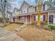 Attractive brick front townhouses with landscaping and sidewalk at 16967 Turning Stick Ct, Charlotte, NC 28213