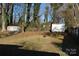 Large backyard with storage shed and fire pit at 208 Nila Dawn Ave, Gastonia, NC 28052