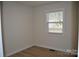 Bright bedroom with hardwood floors and a window at 208 Nila Dawn Ave, Gastonia, NC 28052