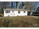 Charming ranch home with white brick exterior and carport at 208 Nila Dawn Ave, Gastonia, NC 28052