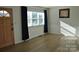 Bright living room featuring hardwood floors and large windows at 208 Nila Dawn Ave, Gastonia, NC 28052
