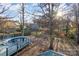 Serene backyard with mature trees and a partially visible pool at 211 Fox Hollow Rd, Mooresville, NC 28117