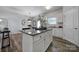 Modern kitchen with granite countertops and white cabinets at 214 Audra Faye Ln, Indian Trail, NC 28079