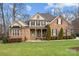 Two-story brick home with landscaping and front porch at 2740 Smith Field Dr, Monroe, NC 28110