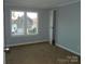 Spacious bedroom with lake view and neutral wall color at 348 Shoreline Rd, New London, NC 28127