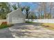 Gray detached garage with a white door at 419 Sylvania Ave, Charlotte, NC 28206