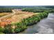 Aerial view showcasing lakefront property and new homes under construction at 5365 Mint Harbor Way # 0300, Charlotte, NC 28269