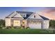 Craftsman style home with stone accents and a two-car garage at 5365 Mint Harbor Way # 0300, Charlotte, NC 28269