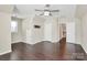 Bright bedroom featuring hardwood floors and multiple closets at 7219 Fortrose Ln, Charlotte, NC 28277