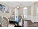 Formal dining room with hardwood floors, a chandelier, and stylish chairs at 7219 Fortrose Ln, Charlotte, NC 28277