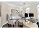 Bright home office featuring hardwood floors and built-in shelving at 7219 Fortrose Ln, Charlotte, NC 28277