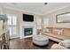 Living Room with a fireplace, hardwood floors, and comfortable seating at 7219 Fortrose Ln, Charlotte, NC 28277